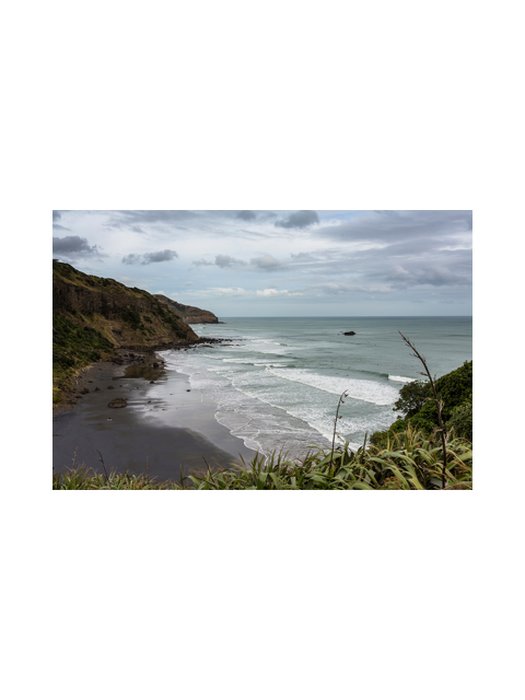 Beautiful beach with black sand and waves